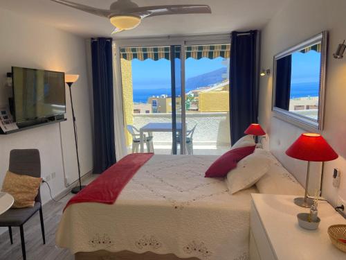 A bed or beds in a room at Estudio Vistamar La Arena