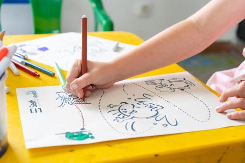 a child drawing on a paper with a pencil at Seth Mestral & Llebeig in Santo Tomás