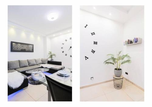 a living room with a couch and a table at Top Ausstattung Netflix WLAN CentrO OLGA-Park in Oberhausen