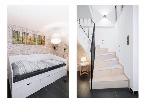 a bedroom with a bed next to a staircase at Top Ausstattung Netflix WLAN CentrO OLGA-Park in Oberhausen