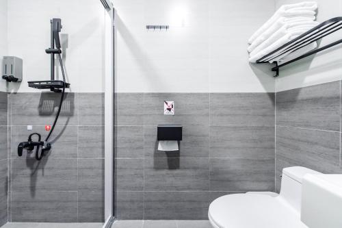 a bathroom with a shower and a toilet at Sun Moon Lake Shui Yang Hall in Yuchi