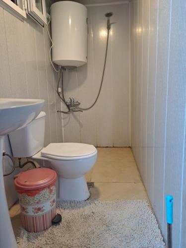 a bathroom with a toilet and a sink at Sweet home in Lalkhori