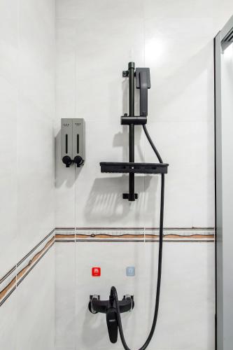 a bathroom with a shower with a faucet at Sun Moon Lake Shui Yang Hall in Yuchi