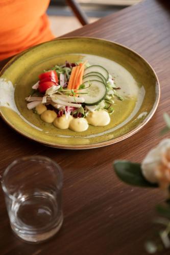 a plate of food with vegetables on a table at Grand Hotel Telese in Telese