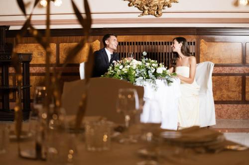 a bride and groom sitting at a table at Grand Hotel Telese in Telese