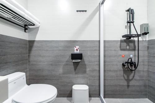 a bathroom with a toilet and a shower at Sun Moon Lake Shui Yang Hall in Yuchi