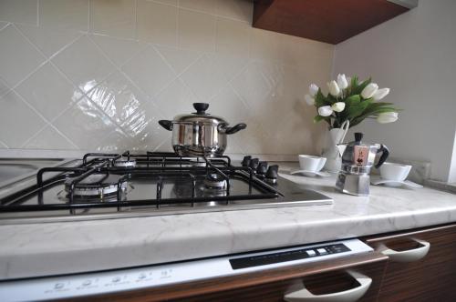 a tea pot sitting on top of a stove in a kitchen at Zefiro Casa Vacanze in Ascea