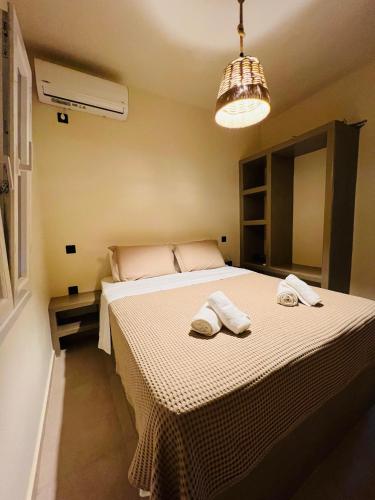 Ένα ή περισσότερα κρεβάτια σε δωμάτιο στο Thermyes Villas 4