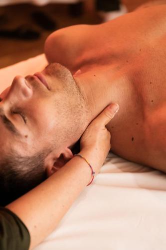 a man laying on a bed with his head on his hand at Grand Hotel Telese in Telese