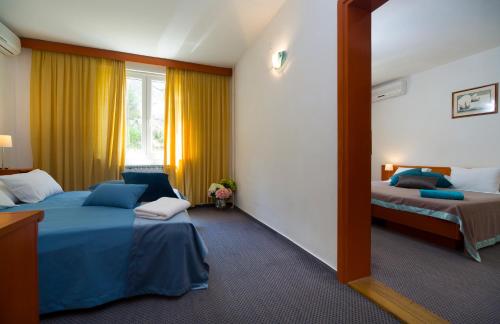 Posteľ alebo postele v izbe v ubytovaní Hotel Faraon
