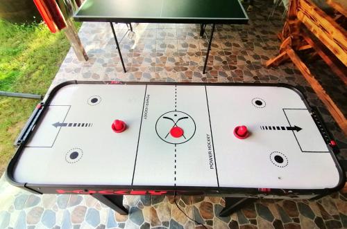 a ping pong table with a face drawn on it at Casa Noastră in Cricău