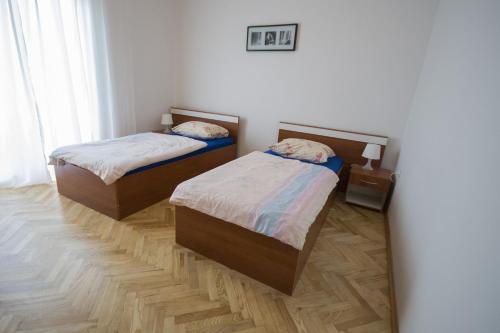 a room with two beds in a room at Apartment Lavanda in Zadar