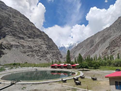 a swimming pool in the middle of a mountain at Dream Nest Resort in Skardu