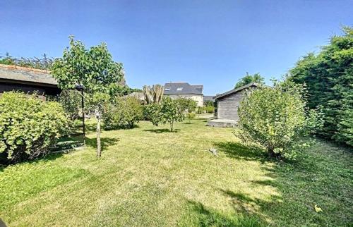 an empty yard with trees and a house at Chez Maurice - Stylish French Country House in Cherrueix
