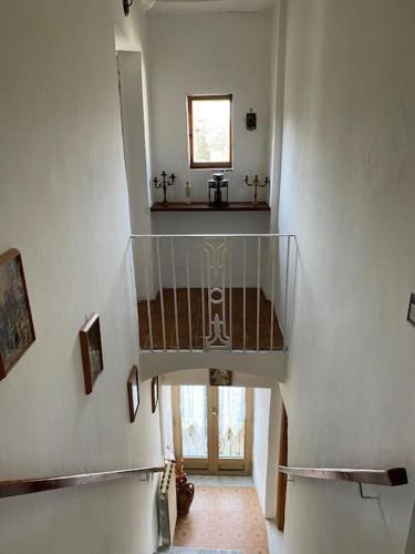 a hallway with a spiral staircase in a house at La Vertecena in Cantalupo nel Sannio