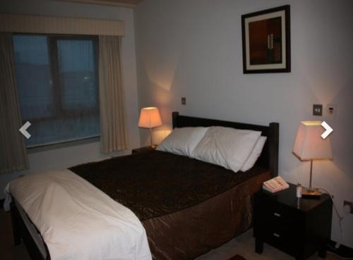 Ένα ή περισσότερα κρεβάτια σε δωμάτιο στο 2 Bed Apartment