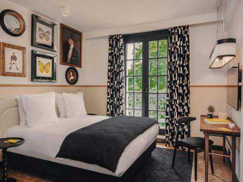 Katil atau katil-katil dalam bilik di Solly Hôtel Paris