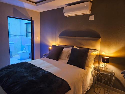 Ένα ή περισσότερα κρεβάτια σε δωμάτιο στο Elson Manor Guesthouse