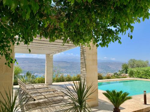 a view from a villa with a swimming pool at Aggelos and Thisbe Chania Suburbs Sea View Guest House in Chania Town