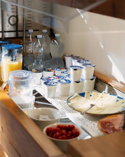 a table with plates of food and drinks on it at I Cinque Pini in Follonica