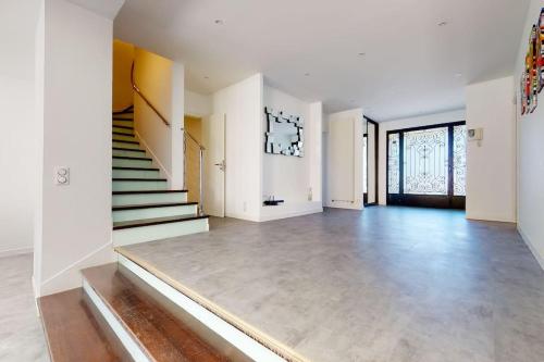 an empty room with a staircase in a house at 13.Studio#Creteil#Loft#Cinéma#Exclusif in Créteil