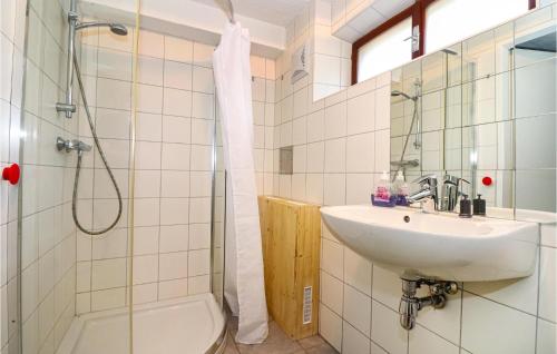a bathroom with a sink and a toilet and a shower at 4 Bedroom Beautiful Home In Deutschlandsberg in Deutschlandsberg