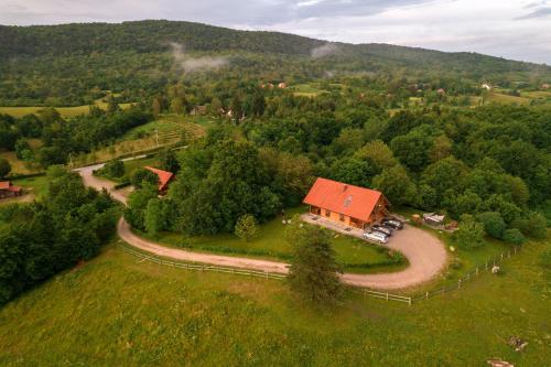 an aerial view of a house in the middle of a field at Ranch Jelov Klanac in Rakovica
