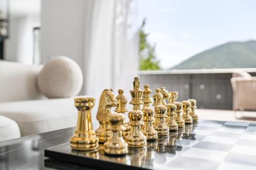 a chess set on a table in a living room at Villa Chou Chou in Steinhaus am Semmering