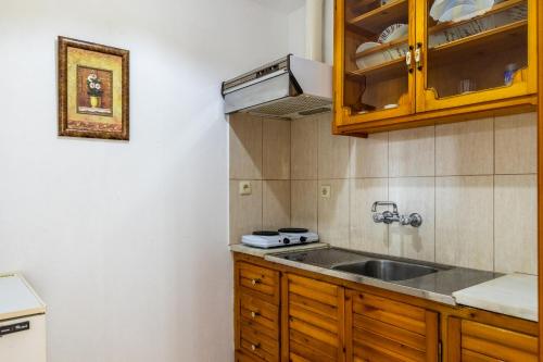 a kitchen with a sink and a counter top at Panagou Studios in Skopelos Town