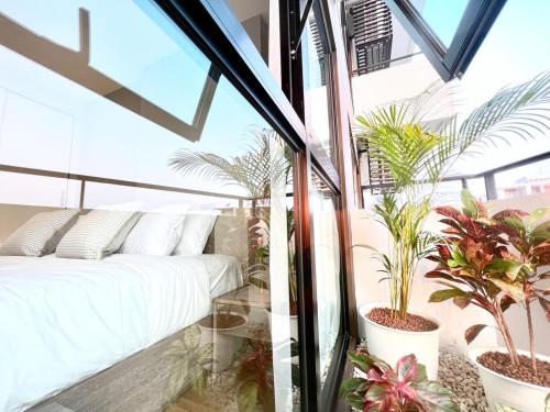 En eller flere senge i et værelse på Astra Sky River Chiang Mai by Fang