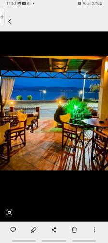 a view of a patio with tables and chairs at Villa Renesans in Star Dojran