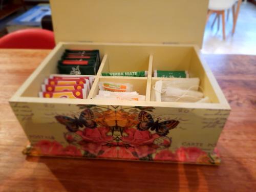 a box filled with books on top of a table at Pacha Home By A.M.A in San Carlos de Bariloche