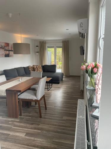 a living room with a table and a couch at Casalino in Wachtendonk