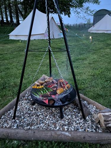 a plate of food on a swing in a park at Willow glamping in Norwich