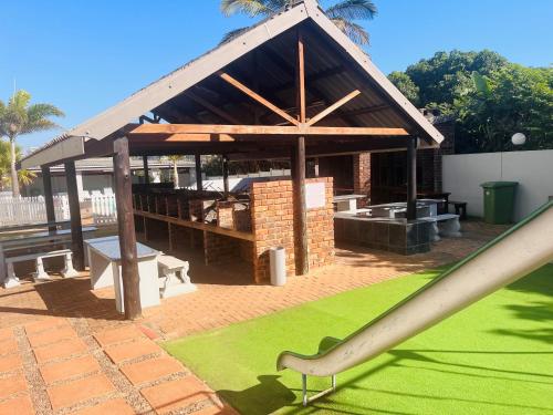 a gazebo with a slide in front of it at Santana 804 Beachfront Apartment with spectacular sea views in Margate