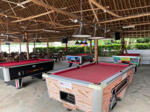 two ping pong tables in a pavilion with tablesktop at The Beach House by Maasai in Mombasa