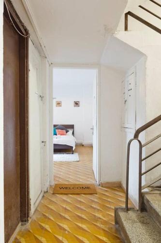 a hallway with a room with a bed in it at Florentine Studio in Tel Aviv