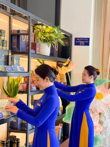 two women standing in a hair salon getting their hair done at Sandals Vista Hotel in Bao Loc