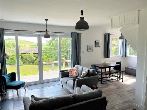 a living room with a couch and a table at Mallaig in Rockcliffe