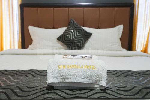 Katil atau katil-katil dalam bilik di New Gentala Hotel RedPartner Medan