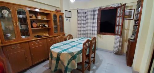 a kitchen with a table and chairs in a room at Lo de Vega in San Salvador de Jujuy