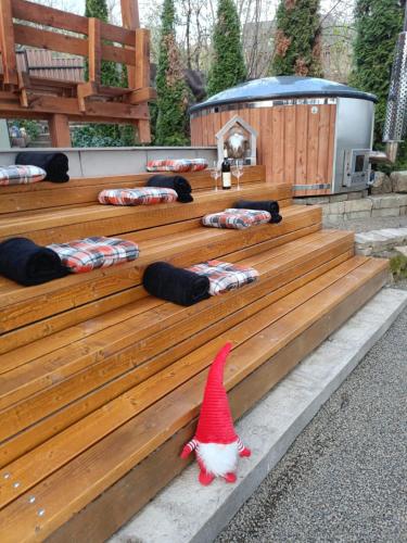 a santa claus hat sitting on a wooden bench at Csudakuckó in Eger