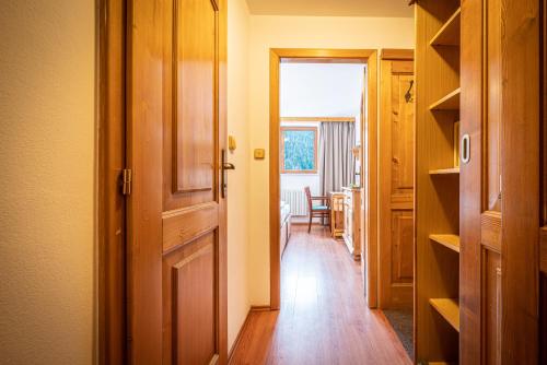 an open door to a room with a hallway at Hotel Sepetná in Ostravice