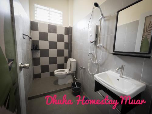 a bathroom with a sink and a toilet at Dhuha Homestay Muar in Muar