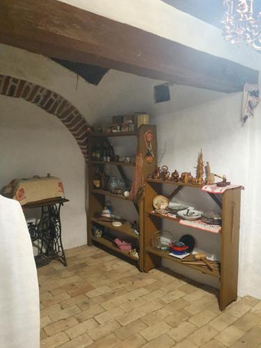 a room with shelves in a room with a ceiling at Pensiunea Aurelia in Şiria