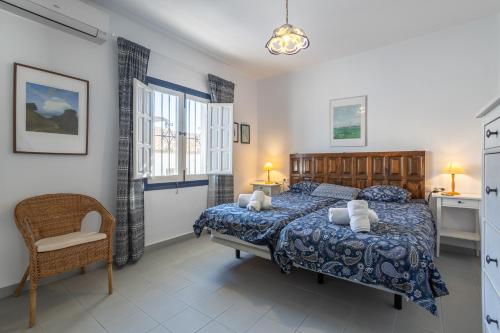 En eller flere senge i et værelse på Plaza Cadiz 10 Villa