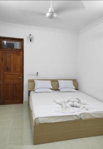 Postel nebo postele na pokoji v ubytování Vandhoo Inn
