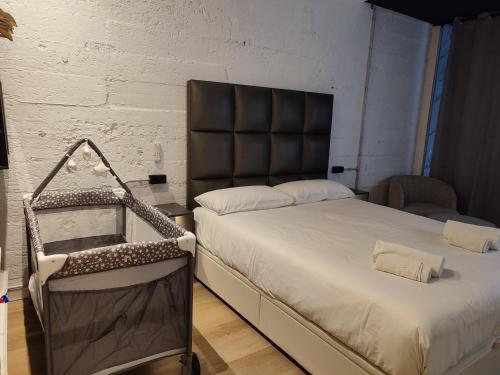a bedroom with a bed with a black headboard at MBE Premium Centro Ciudad Bilbao in Bilbao