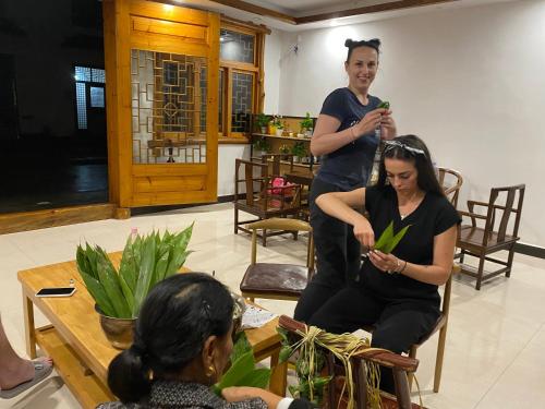 a woman getting her hair cut in a salon at Easy House in Zhangjiajie