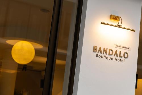 a door sign for bandalo boutique hotel at Bandalo Boutique Hotel - Patong Beach Road in Patong Beach